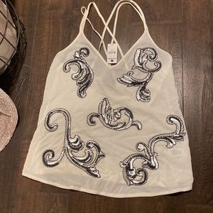 Express top with sequin design